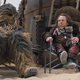 Chewbacca (Joonas Suotamo) and Weazel (Warwick Davis) take a brief moment of relaxation on Savareen.